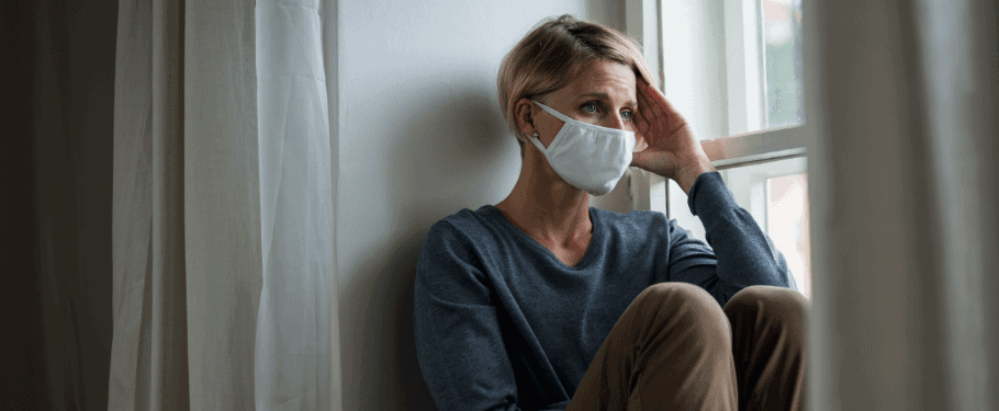 woman wearing mask with stress about COVID